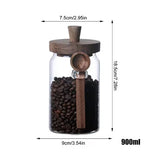 Gläserne Vorratsdosen mit Holzdeckel und Löffel